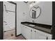Updated bathroom with dark granite counters, white cabinets, and walk-in shower at 450 Tot Dellinger Rd, Cherryville, NC 28021