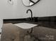 Close-up of a bathroom vanity with granite counters and modern fixtures at 450 Tot Dellinger Rd, Cherryville, NC 28021