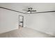 Spacious carpeted bedroom features a ceiling fan, and access to the attached ensuite bathroom at 450 Tot Dellinger Rd, Cherryville, NC 28021