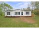 Charming single-story home with a well-manicured lawn and inviting front entrance at 450 Tot Dellinger Rd, Cherryville, NC 28021
