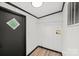 Bright mud room features wood-look vinyl flooring, shelving, and an exterior door with a diamond window at 450 Tot Dellinger Rd, Cherryville, NC 28021