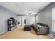 Spacious living room with neutral walls, a comfortable couch, and carpeted flooring at 4919 Manchineel Ln, Monroe, NC 28110