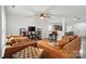 Spacious living room with hardwood floors, ceiling fan, and comfortable seating, creating a cozy atmosphere at 4919 Manchineel Ln, Monroe, NC 28110