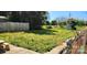 Spacious backyard featuring wooden fence, landscaping, and playset at 502 And 504 Church St, Belmont, NC 28012