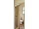 Cozy bathroom featuring a shower-tub combo and a standard white toilet with natural light coming through the window at 502 And 504 Church St, Belmont, NC 28012