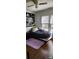 Bedroom with wood floors, ceiling fan, and a window letting in natural light at 502 And 504 Church St, Belmont, NC 28012