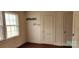 Bedroom with hardwood floors, natural light, and doors to the closets at 502 And 504 Church St, Belmont, NC 28012