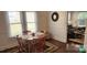 Dining area with wood table, seating for four, and access to another room at 502 And 504 Church St, Belmont, NC 28012