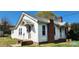 Charming home exterior with brick chimney, updated windows, and a covered side entry at 502 And 504 Church St, Belmont, NC 28012