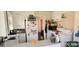 Galley kitchen with vintage white appliances, cabinets and fixtures, and an open doorway beyond at 502 And 504 Church St, Belmont, NC 28012