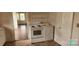 Kitchen featuring a white range and storage cabinet at 502 And 504 Church St, Belmont, NC 28012