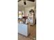 Galley kitchen with white cabinets and appliances, offering a clean and functional space at 502 And 504 Church St, Belmont, NC 28012