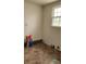 Empty room with linoleum flooring, a window, and white walls at 502 And 504 Church St, Belmont, NC 28012