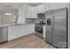 Modern kitchen featuring stainless steel appliances, white cabinets, and granite countertops at 505 Mt. Mitchell Ave # 505, Gastonia, NC 28052