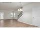 Open floor plan with light-colored wood flooring, a stairway with wood banister, and a rear door at 505 Mt. Mitchell Ave # 505, Gastonia, NC 28052