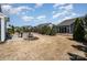 Spacious backyard with a brick patio and built-in grill, perfect for outdoor entertaining at 5115 Sand Trap Ct, Monroe, NC 28112