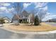 Inviting two-story home with a well-manicured lawn and mature trees, offering great curb appeal at 5115 Sand Trap Ct, Monroe, NC 28112