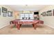 Spacious game room with a billiard table, overhead lighting, and plenty of wall decor to create a fun atmosphere at 5115 Sand Trap Ct, Monroe, NC 28112