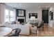 Cozy living room with fireplace, comfortable seating, and plenty of natural light at 5247 Hatcher Creek Rd # 48, Charlotte, NC 28215