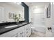 A bright bathroom featuring double sinks, modern fixtures, and a shower-tub combo with updated decor at 5248 Hatcher Creek Rd # 49, Charlotte, NC 28215