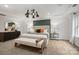 A serene main bedroom showcasing a decorative panel wall, bench, and elegant lighting fixtures at 5248 Hatcher Creek Rd # 49, Charlotte, NC 28215