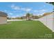 Expansive backyard featuring a well-maintained lawn and privacy fence, perfect for outdoor activities at 5467 Whiting Ave, Kannapolis, NC 28083