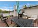 Outdoor entertaining area with a spacious deck, furniture, barbecue grill, and lush backyard at 5467 Whiting Ave, Kannapolis, NC 28083
