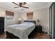 Comfortable bedroom featuring neutral tones, hardwood floors, and lots of natural light at 5467 Whiting Ave, Kannapolis, NC 28083