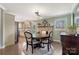 A dining room with fireplace adjoins the kitchen, offering a seamless flow for entertaining at 5467 Whiting Ave, Kannapolis, NC 28083
