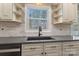 Updated kitchen featuring stainless steel appliances, modern countertops, and natural light from the window at 5467 Whiting Ave, Kannapolis, NC 28083