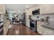 Open-concept layout connecting a modern kitchen and an elegant dining room at 5467 Whiting Ave, Kannapolis, NC 28083