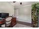 Comfortable home office with hardwood floors, a large monitor, and a bookshelf at 5467 Whiting Ave, Kannapolis, NC 28083