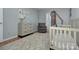 Bright bedroom featuring an area rug, grey walls, and ample space for furniture at 6201 Sellars Ct, Charlotte, NC 28211