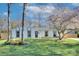 Charming home featuring a well-maintained lawn and beautiful flowering trees at 6201 Sellars Ct, Charlotte, NC 28211