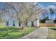 Attractive home with well-manicured lawn and a blossoming tree adding to its curb appeal at 6201 Sellars Ct, Charlotte, NC 28211