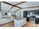 Modern kitchen with dark cabinets, granite countertops, a center island, and stainless steel appliances at 6201 Sellars Ct, Charlotte, NC 28211
