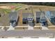 Aerial view shows the neighborhood with well-maintained lawns, driveways and nearby green spaces at 650 Scotch Meadows Loop, Monroe, NC 28110