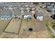 Aerial view highlights large backyard amenities, including a trampoline and playset in an open grassy space at 650 Scotch Meadows Loop, Monroe, NC 28110
