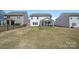 Expansive backyard with covered porch perfect for outdoor relaxation and entertaining, with ample space for activities at 650 Scotch Meadows Loop, Monroe, NC 28110