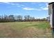Large backyard surrounded by a black fence and a playground at 650 Scotch Meadows Loop, Monroe, NC 28110