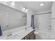 Bright bathroom featuring a double vanity, shower and bathtub combination at 650 Scotch Meadows Loop, Monroe, NC 28110
