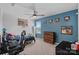 Bright bedroom with blue accent wall, sporty decorations, and carpet flooring at 650 Scotch Meadows Loop, Monroe, NC 28110