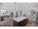 Spacious kitchen with a large island, modern lighting, and an open floor plan at 650 Scotch Meadows Loop, Monroe, NC 28110