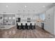 Spacious kitchen with white cabinets, a dark island, and seating for four at 650 Scotch Meadows Loop, Monroe, NC 28110