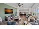 Open concept living room with stylish furnishings, kitchen view, and hardwood floors at 650 Scotch Meadows Loop, Monroe, NC 28110