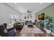 Inviting living room with stylish decor, a cozy sofa, modern lighting, and an accent wall for visual interest at 650 Scotch Meadows Loop, Monroe, NC 28110