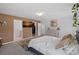 Bright main bedroom features tan accent wall, closet, and large dresser at 650 Scotch Meadows Loop, Monroe, NC 28110