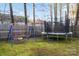Large backyard with swing set and trampoline, perfect for outdoor fun at 6645 Allness Glen Ln, Charlotte, NC 28269
