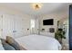 Bright bedroom with a ceiling fan, television, dresser, closet, and ample natural light at 6645 Allness Glen Ln, Charlotte, NC 28269