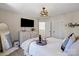 Well-decorated bedroom with a dresser, ceiling fan, and modern decor at 6645 Allness Glen Ln, Charlotte, NC 28269